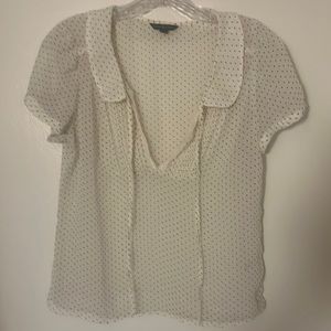 White with black polka dotted blouse.